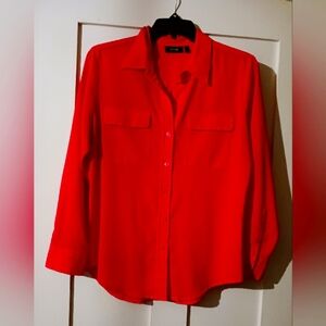 Long-sleeved button down blouse.